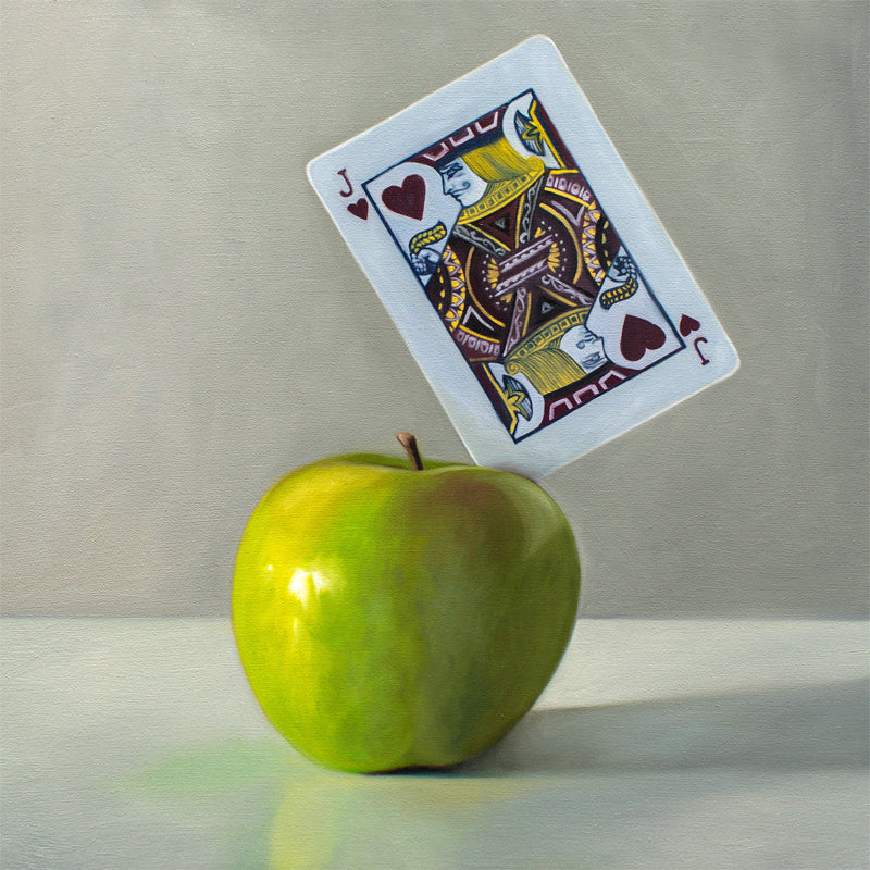 This artwork features a pun on the word ‘Applejack’. A Jack of Hearts playing card is embedded in the upper right corner of a bright green granny smith apple.