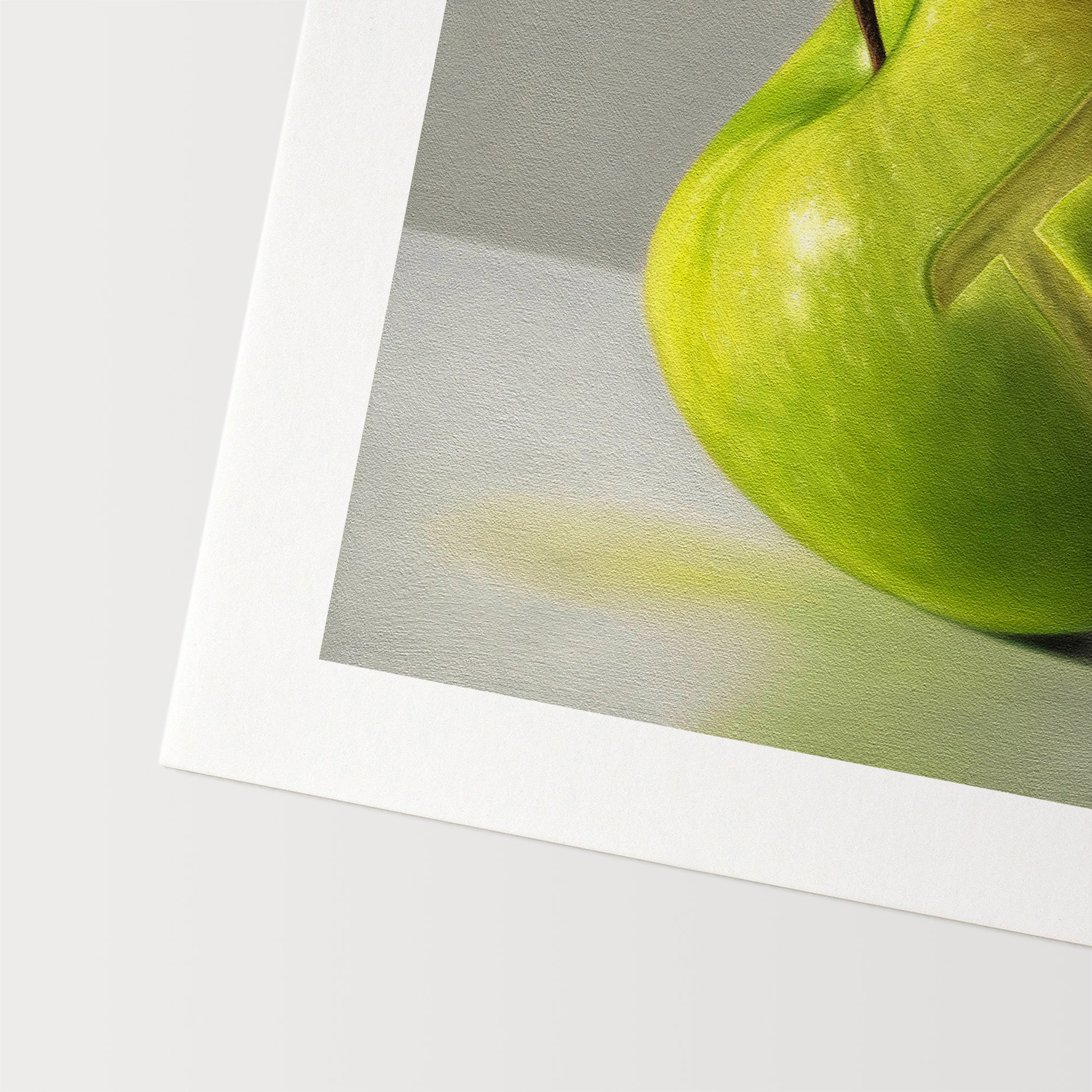 This artwork features a whimsical pun on apple pie. A numeric pi symbol is carved into the front of a granny smith apple.