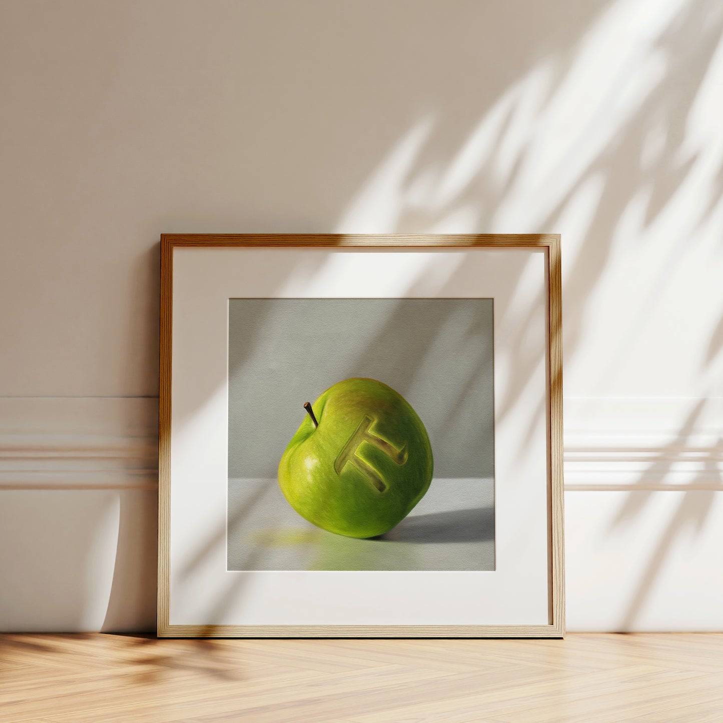 This artwork features a whimsical pun on apple pie. A numeric pi symbol is carved into the front of a granny smith apple.