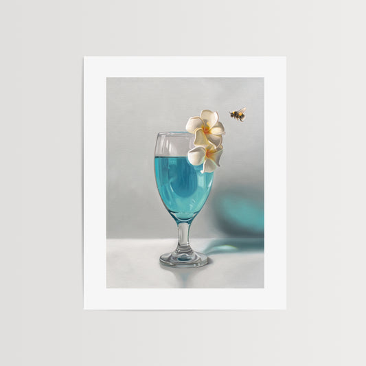 This artwork features a curious bumble bee inspecting a pair of plumeria blossoms that rest upon a tropical blue lagoon cocktail.