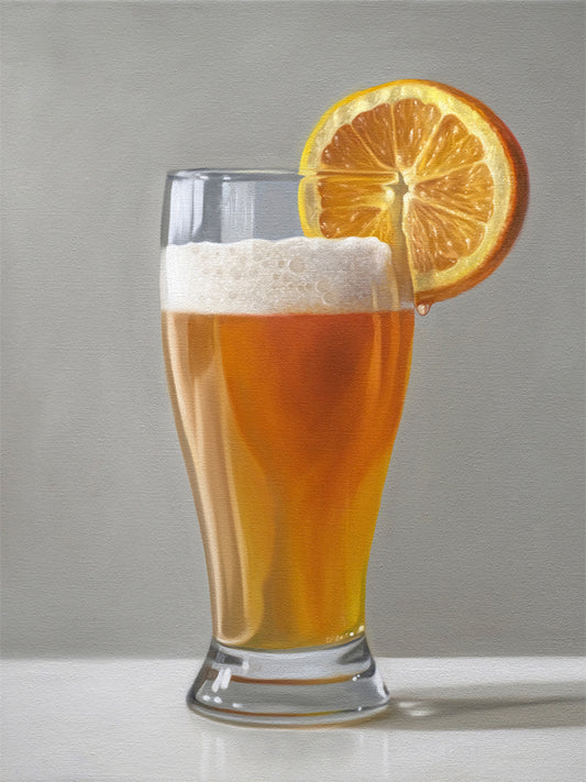 This artwork features a freshly poured Blue Moon beer in a glass with an orange slice and a nice bit of foam.