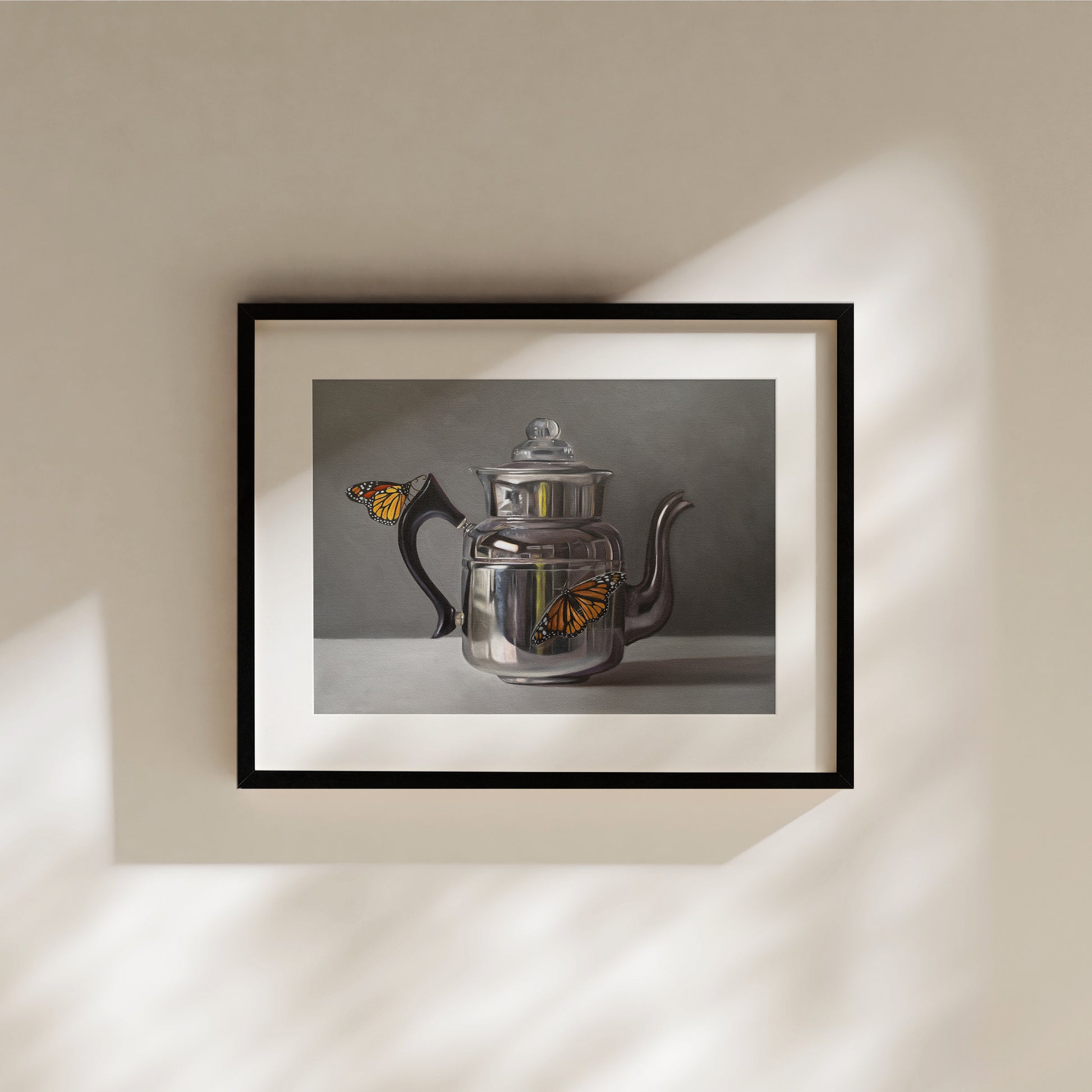This artwork features a pair of monarch butterflies perched on a vintage reflective kettle.