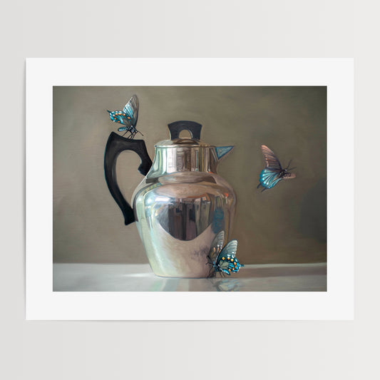 This artwork features a trio of blue butterflies surrounding a vintage tea kettle.This artwork is from a series featuring tea kettles paired with various objects.