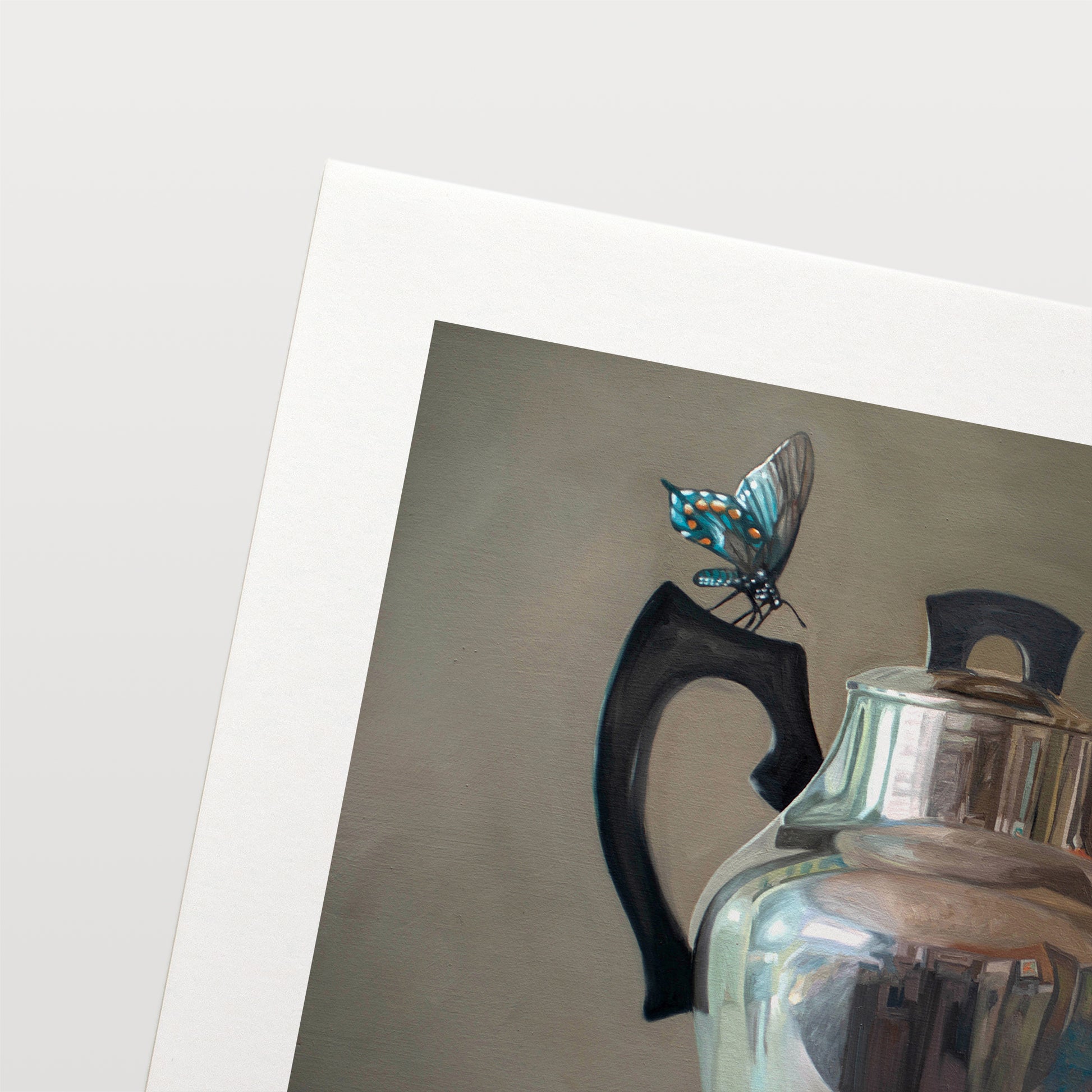 This artwork features a trio of blue butterflies surrounding a vintage tea kettle.This artwork is from a series featuring tea kettles paired with various objects.