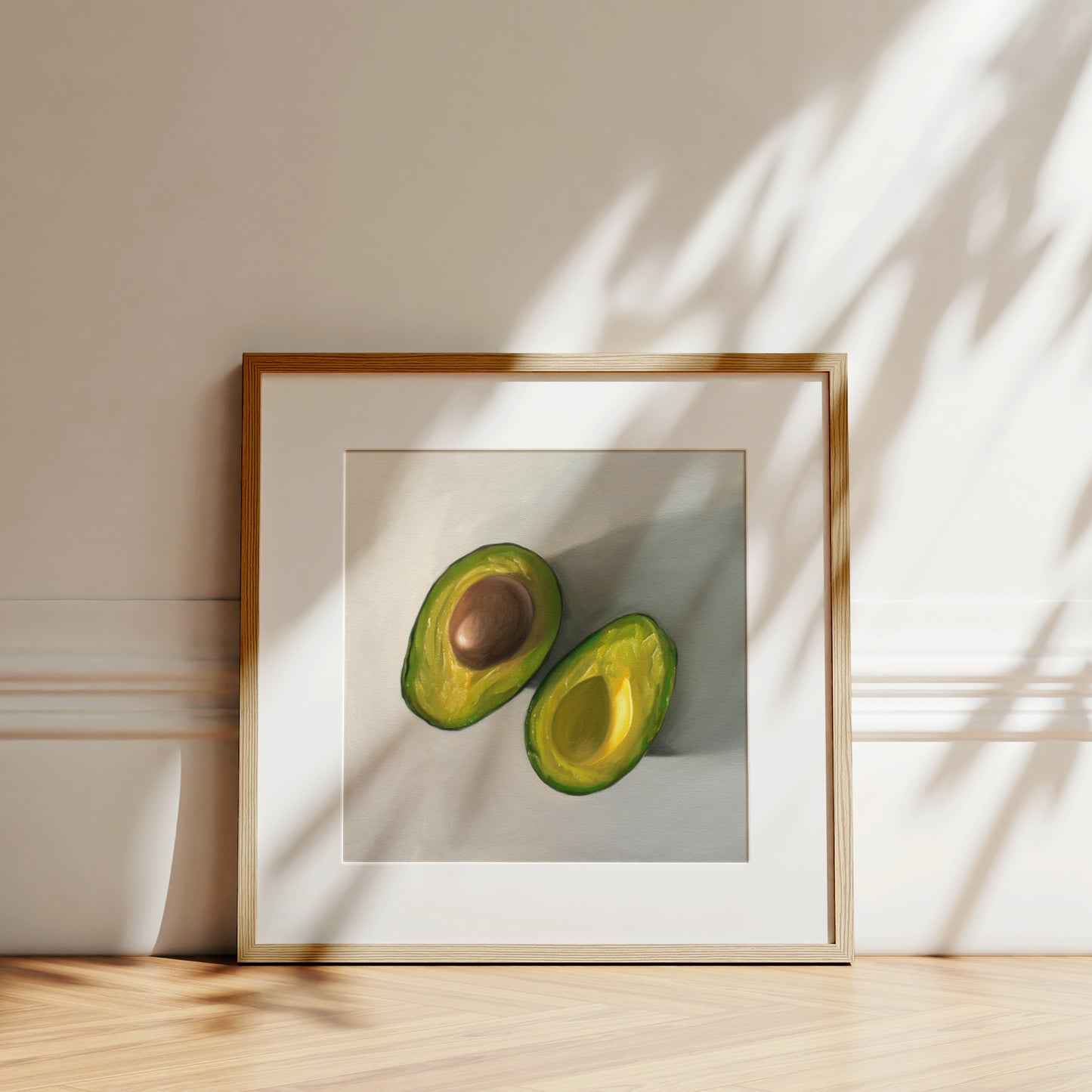 This artwork features a single avocado sliced in half and viewed from above on a light surface.
