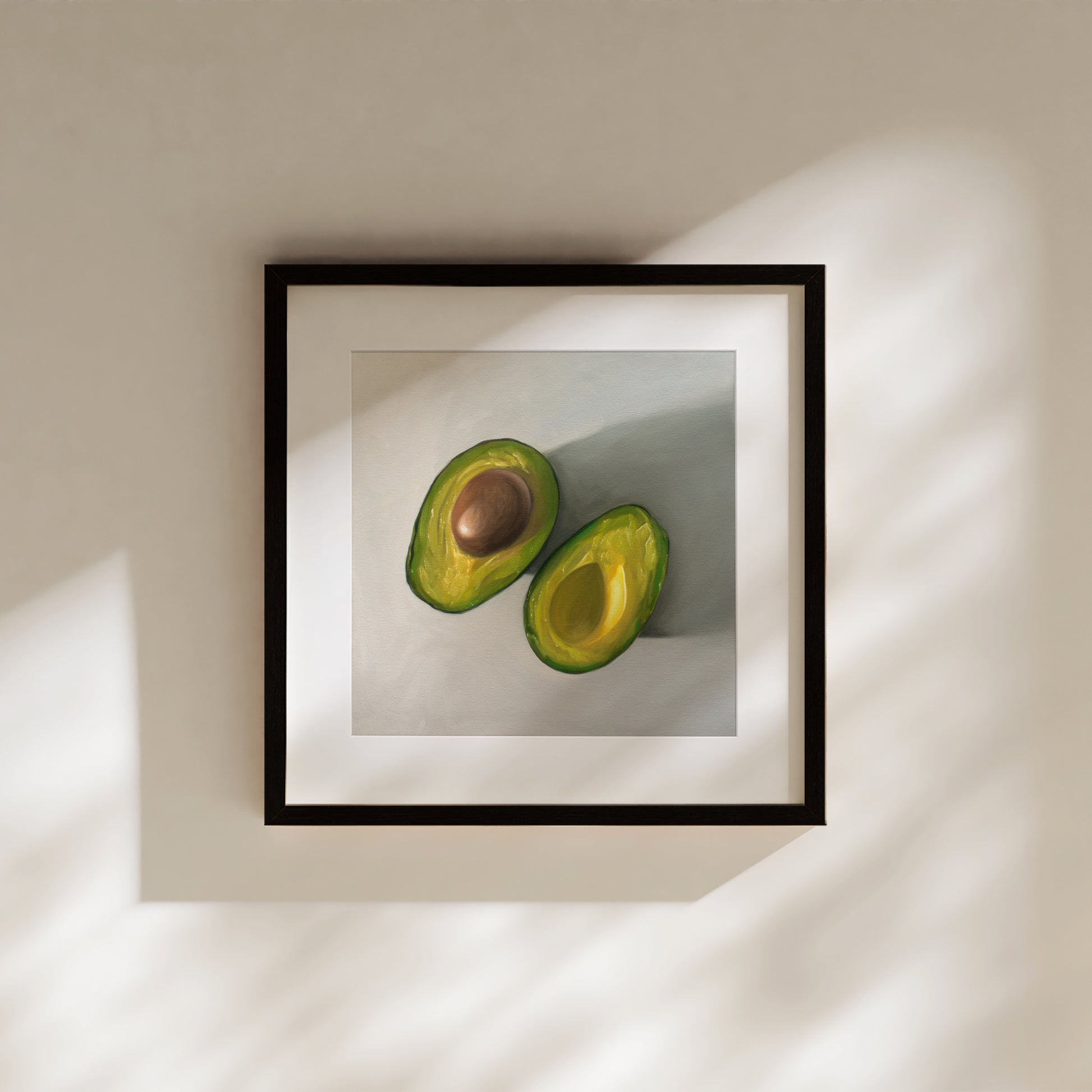 This artwork features a single avocado sliced in half and viewed from above on a light surface.