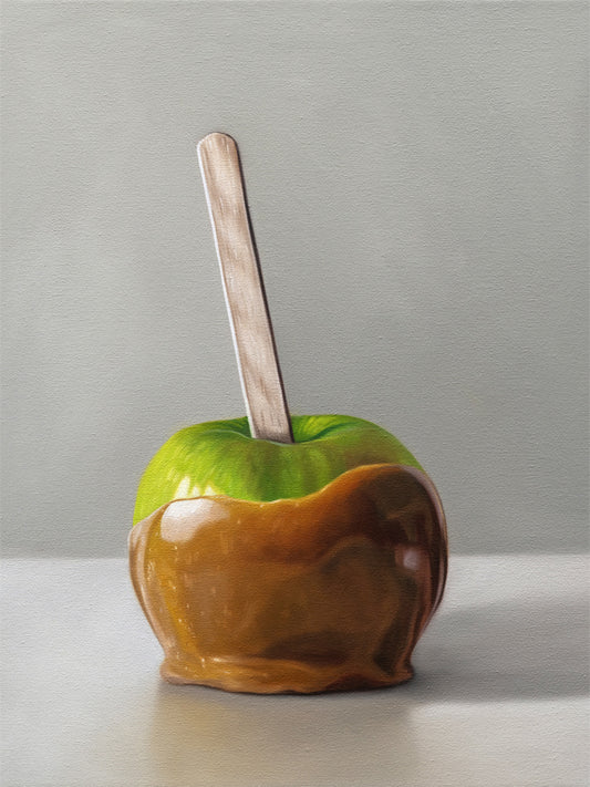 This artwork features a freshly dipped caramel apple resting on a light, reflective surface.