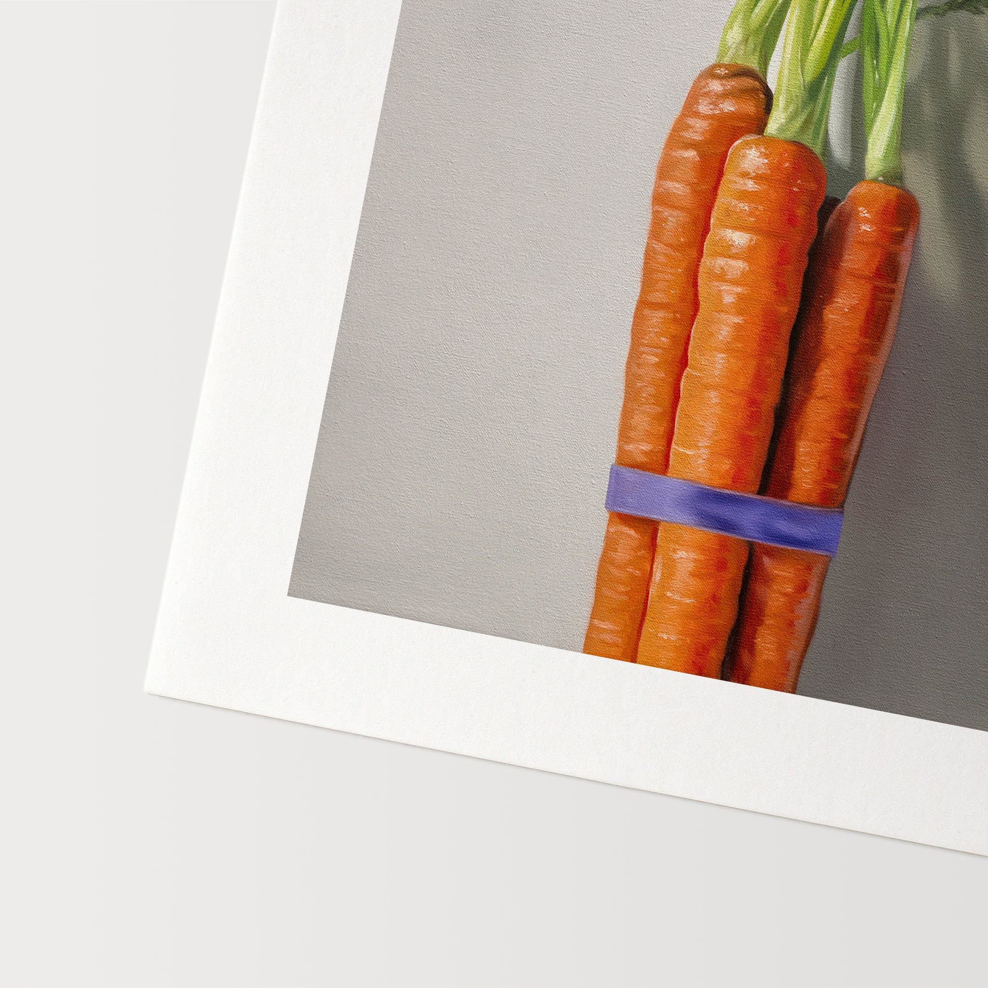 This artwork features a bundle of carrots resting on a neutral grey surface with dramatic side lighting creating interesting cast shadows.