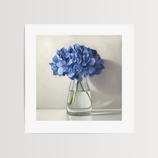 This artwork features a bouquet of blue hydrangeas in a glass vase with a light grey neutral background dramatic side-lighting.