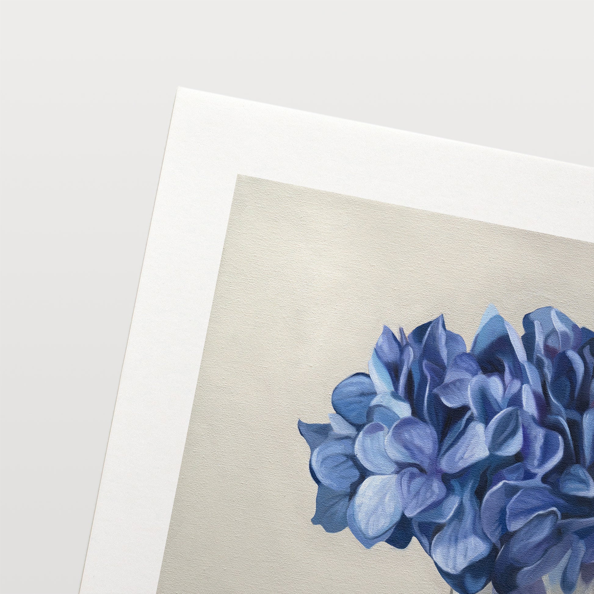 This artwork features a bouquet of blue hydrangeas in a glass vase with a light grey neutral background dramatic side-lighting.
