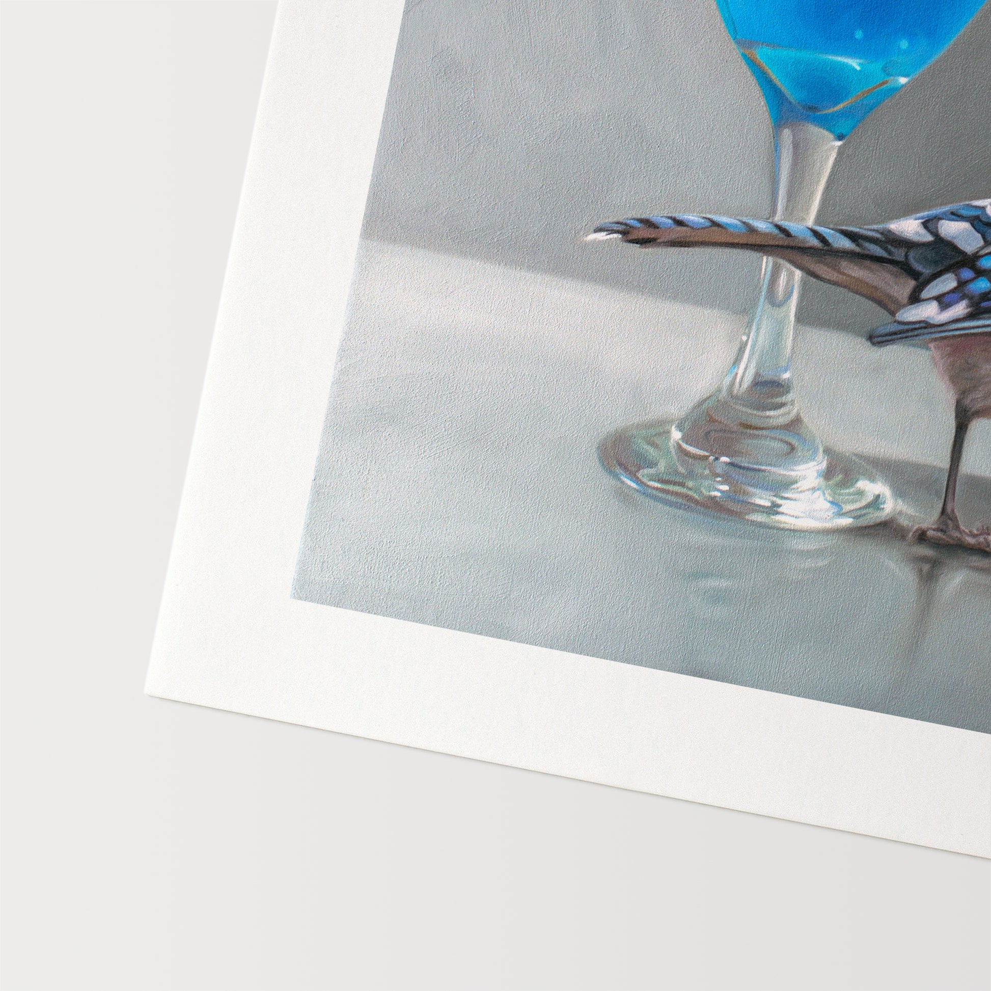 This artwork features a blue martini paired with a Blue Jay.This artwork is from a series of paintings that I am working on featuring birds and beverages.