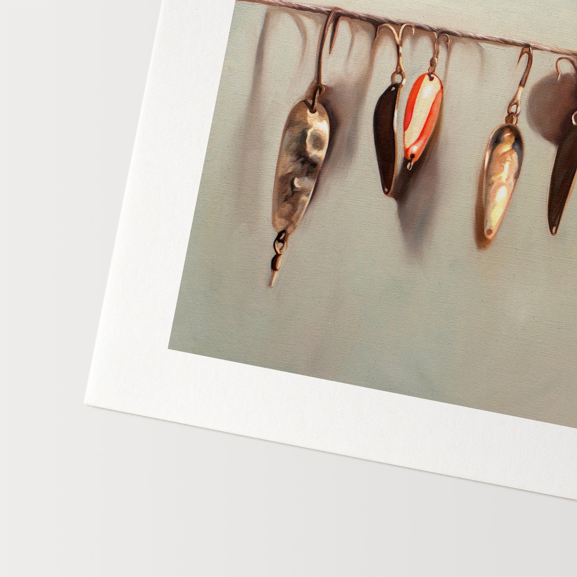 This artwork features a string fashioned with a variety of vintage fishing lures.