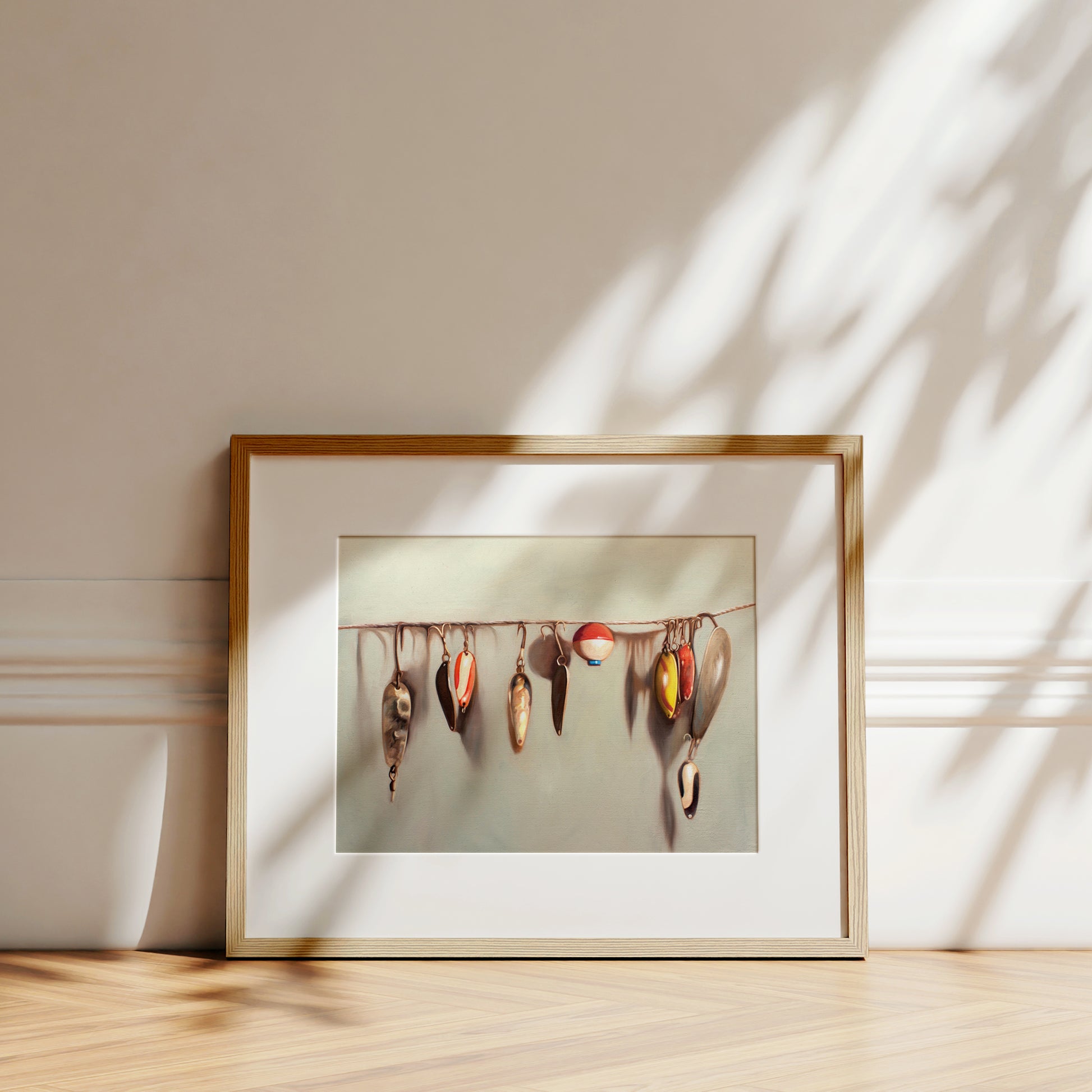 This artwork features a string fashioned with a variety of vintage fishing lures.