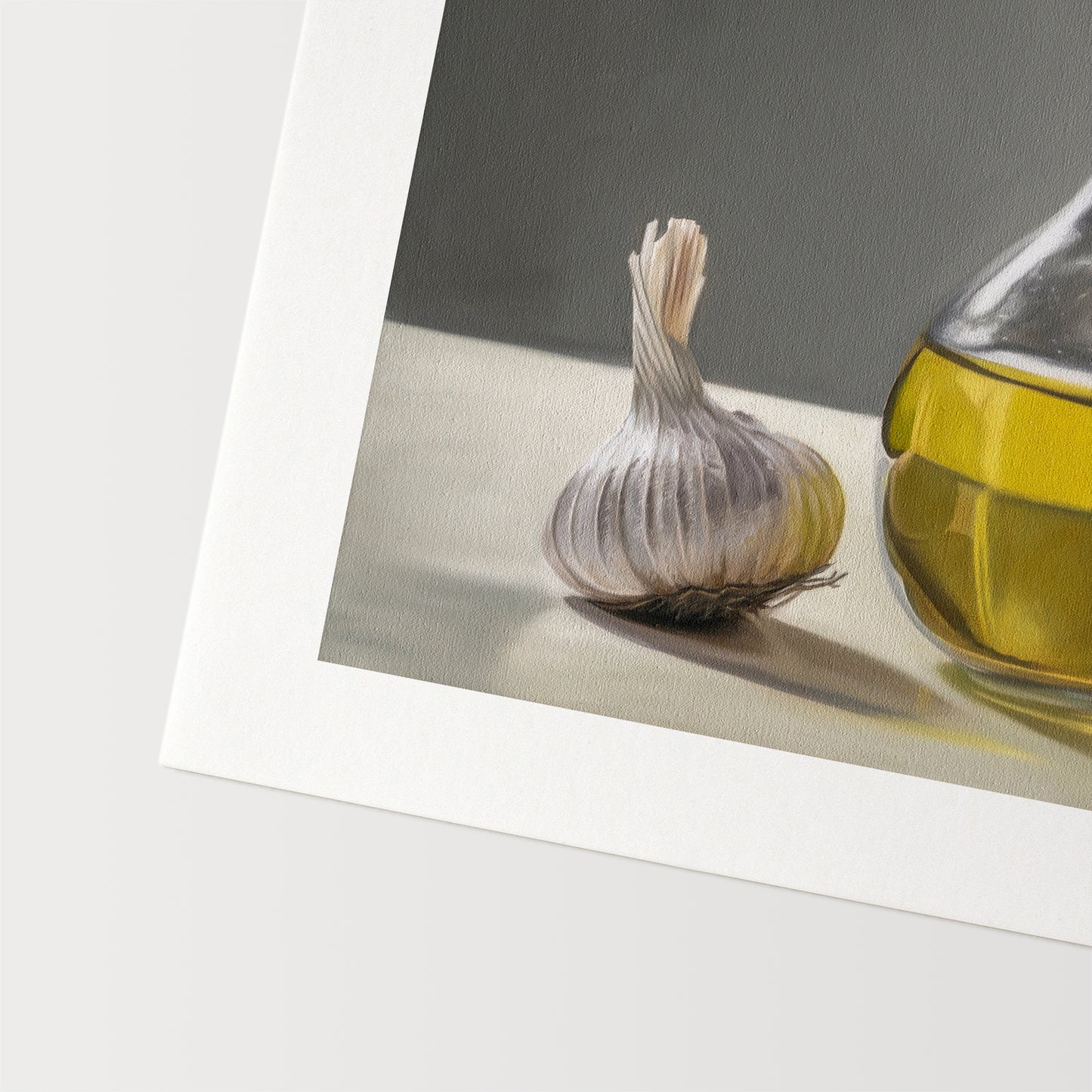 This artwork features a garlic bulb resting next to a backlit olive oil curet resting on a light surface with a neutral grey background.