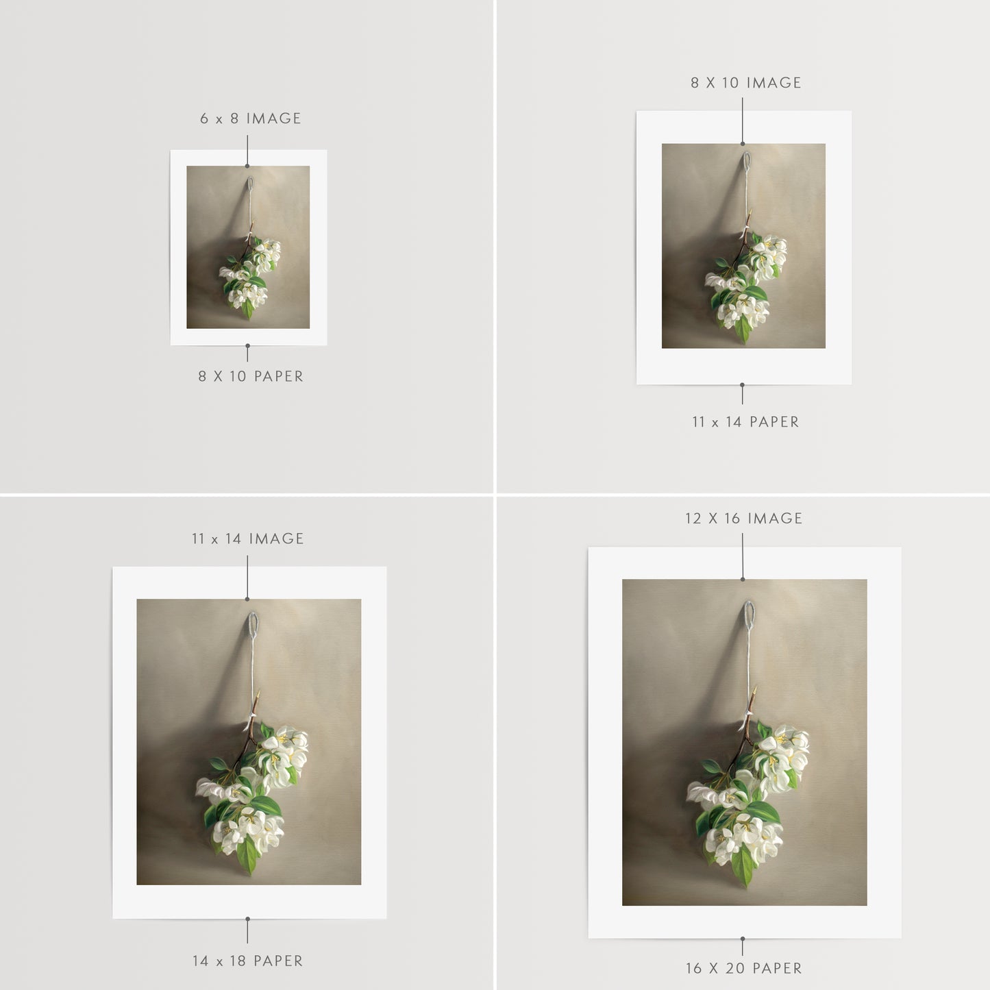 This artwork features a branch of crabapple blossoms hanging adjacent to a warm grey surface.