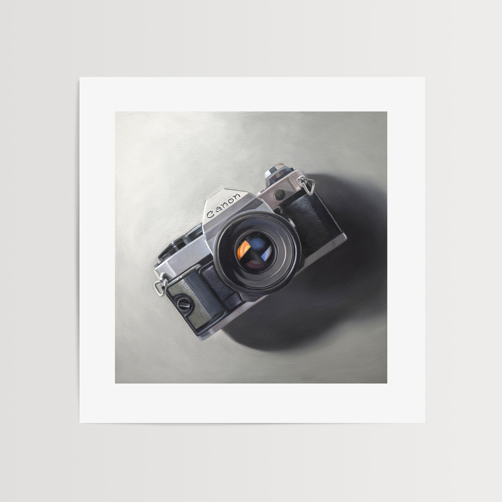 This oil painting features a vintage Canon AE-1 camera resting on a neutral surface with dramatic side lighting.