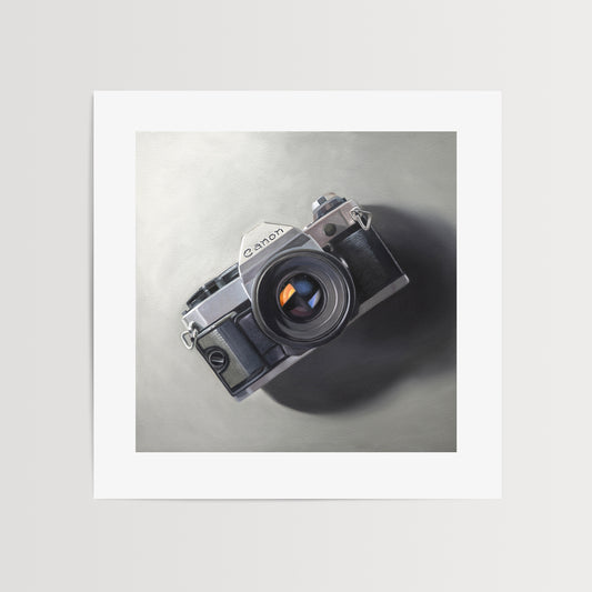 This oil painting features a vintage Canon AE-1 camera resting on a neutral surface with dramatic side lighting.