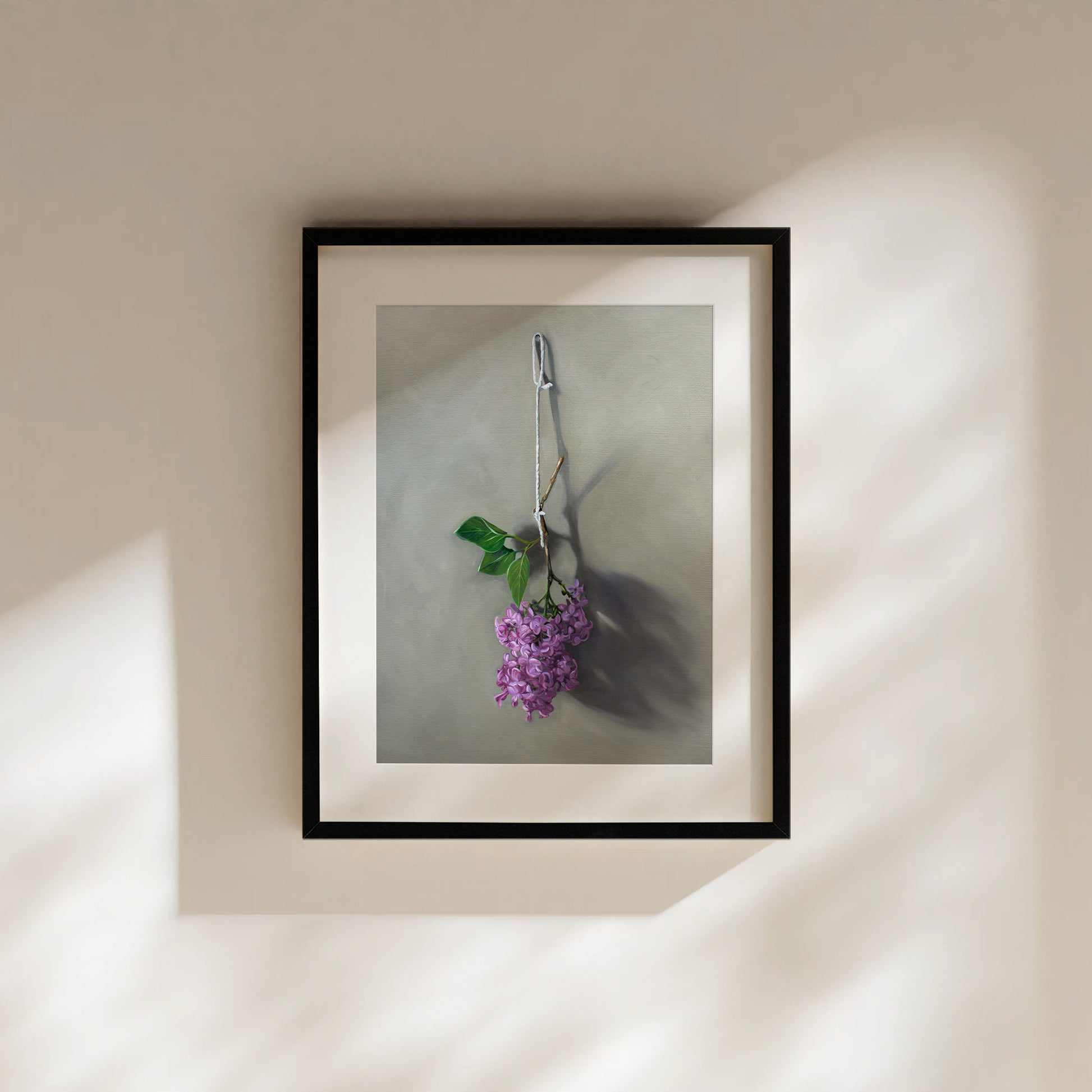 This artwork features Lilac blossoms hanging adjacent to a wall.