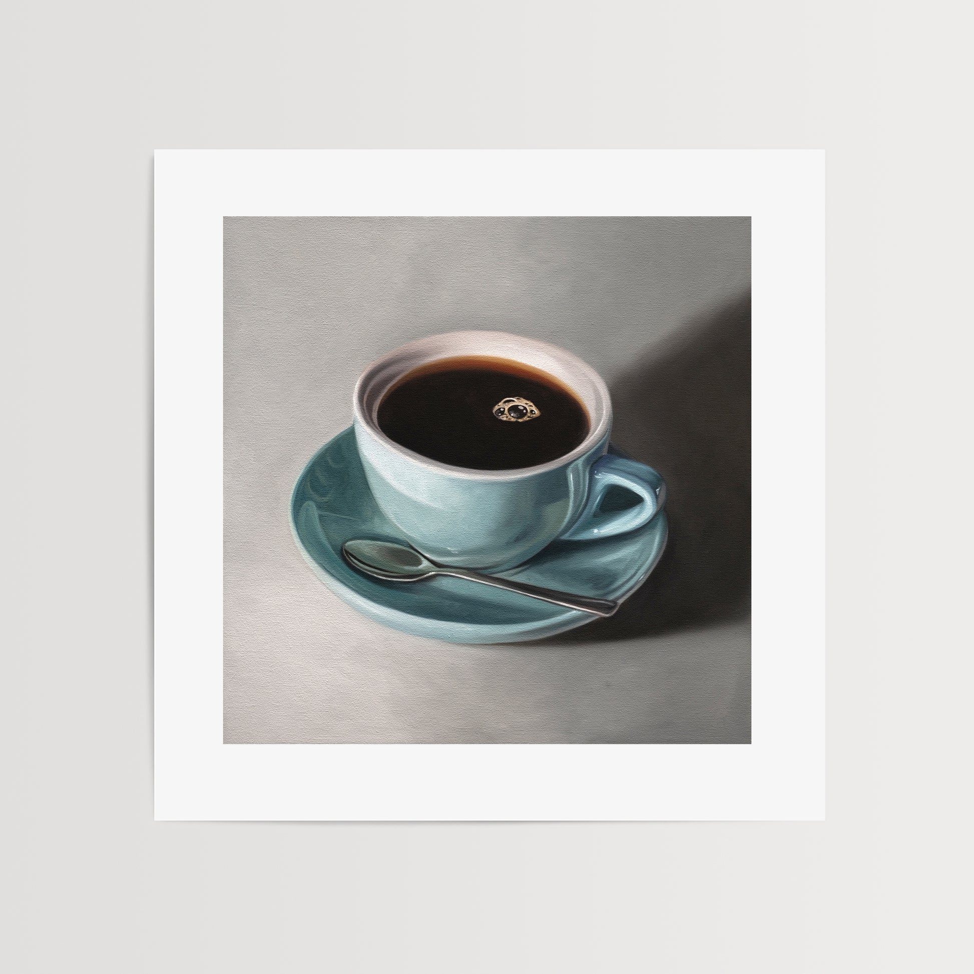 This artwork features a light blue cup of coffee resting on a saucer with a spoon..