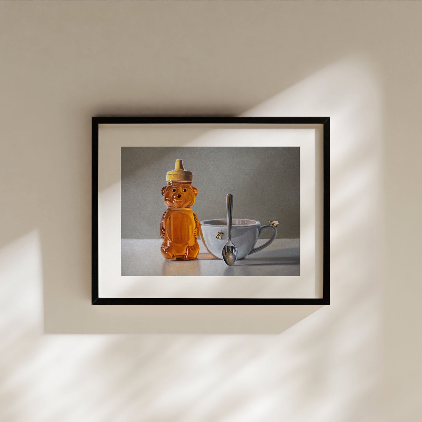 This artwork features a honey bear bottle, cup with spoon and two curious honey bees.