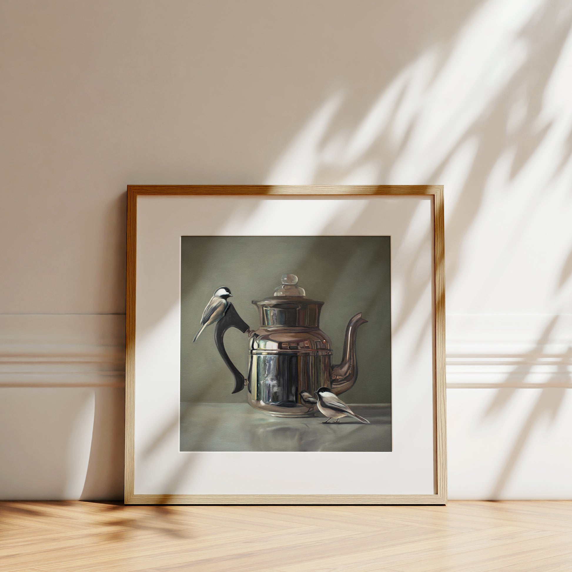 This artwork features a pair of chickadees inspecting a vintage tea kettle.This artwork is from a series featuring tea kettles paired with various objects.