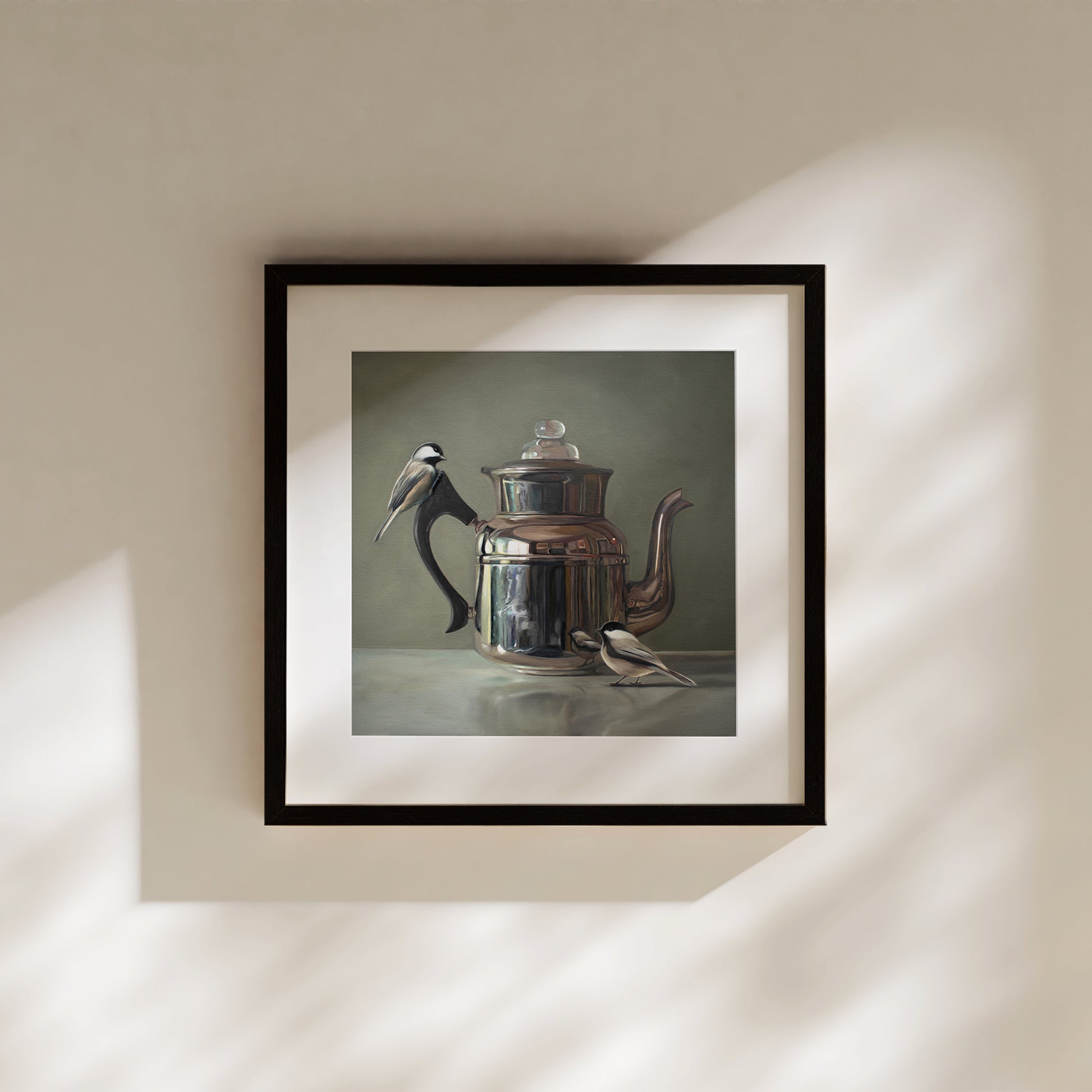 This artwork features a pair of chickadees inspecting a vintage tea kettle.This artwork is from a series featuring tea kettles paired with various objects.
