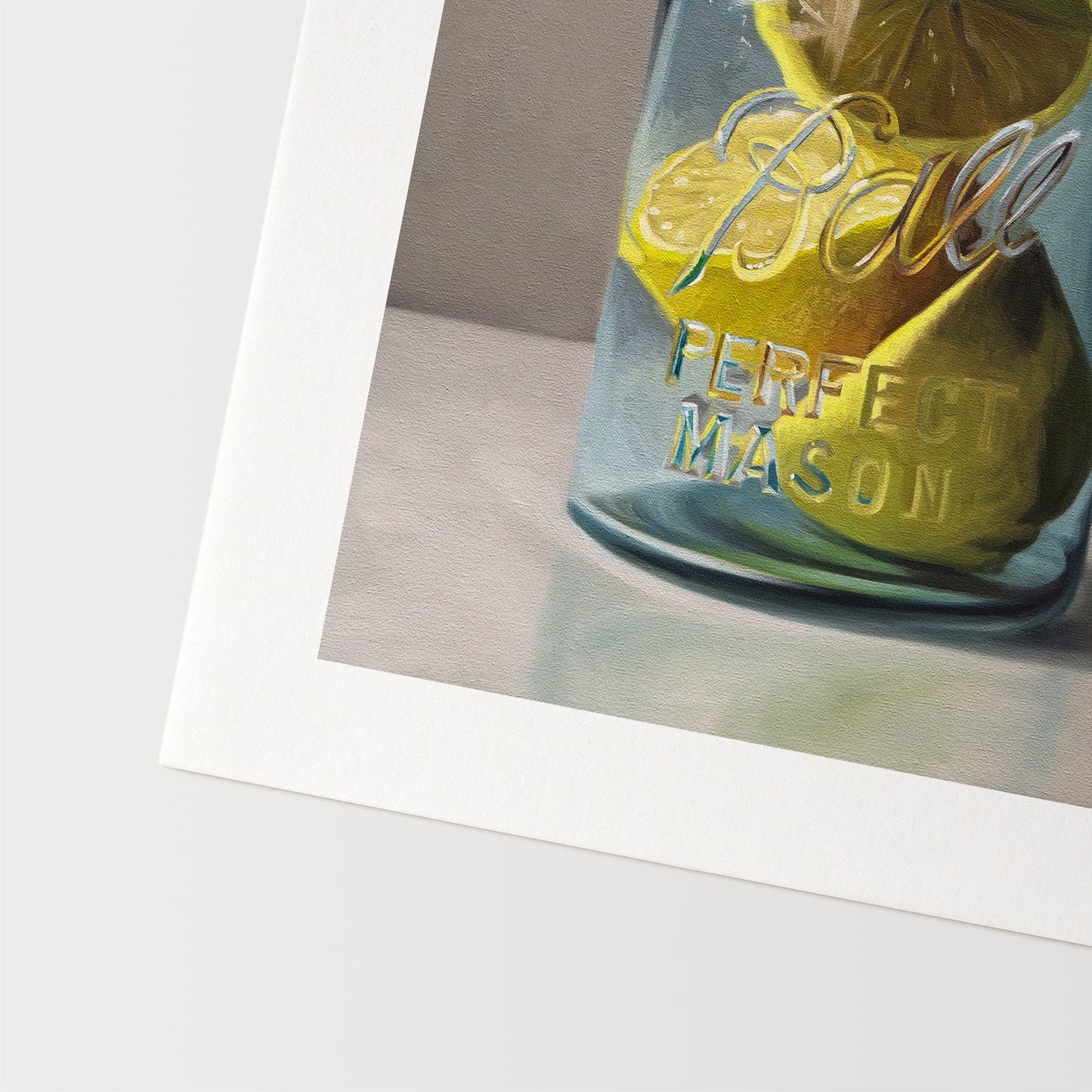 This artwork features a vintage turquoise jar containing a trio of lemon halves.