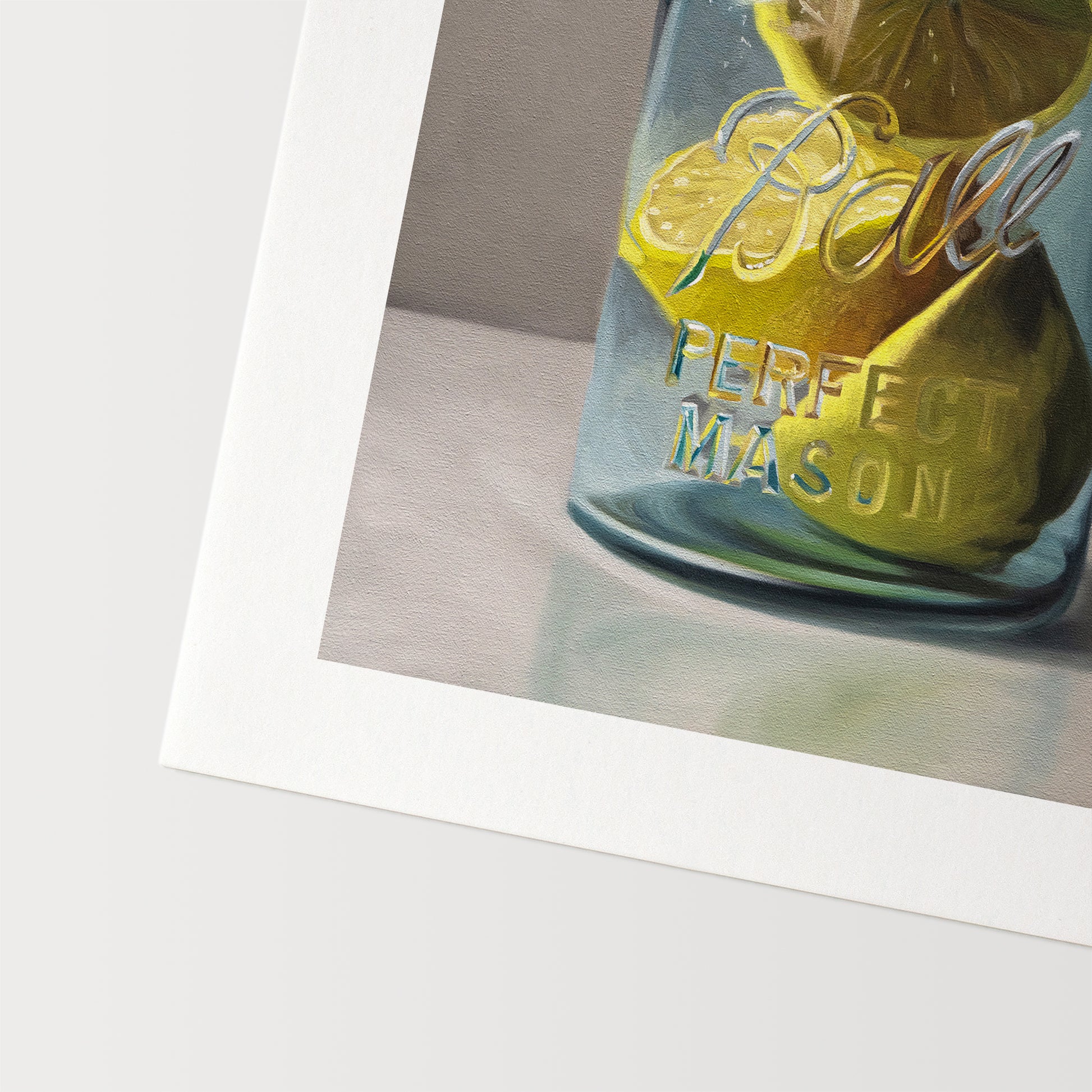 This artwork features a vintage turquoise jar containing a trio of lemon halves.