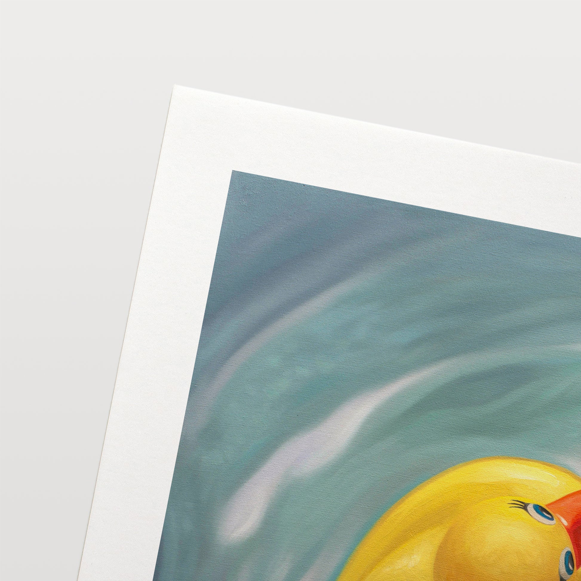This artwork features a single rubber ducky floating in blue rippled water from above.