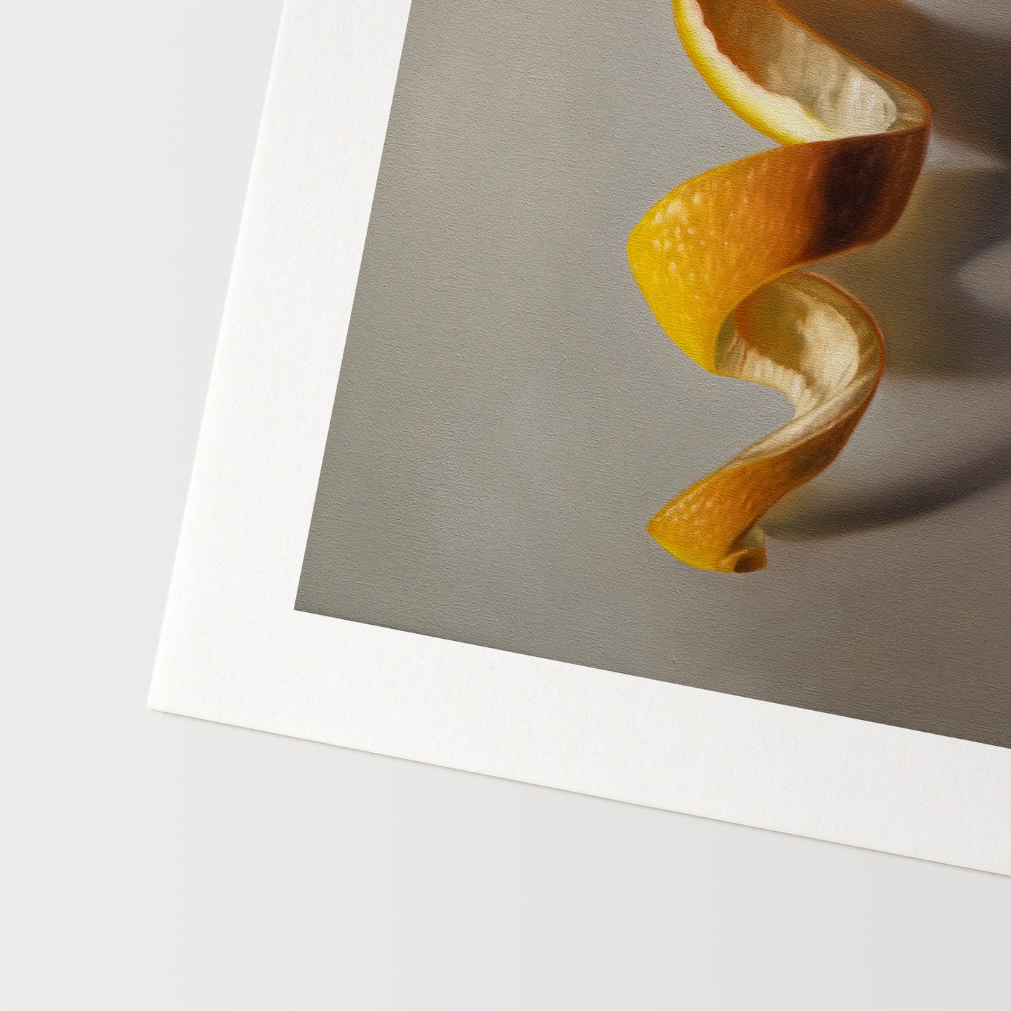 This artwork features a freshly sliced orange with its peeling spiraling in a downward fashion with dramatic side-lighting creating interesting cast shadows.