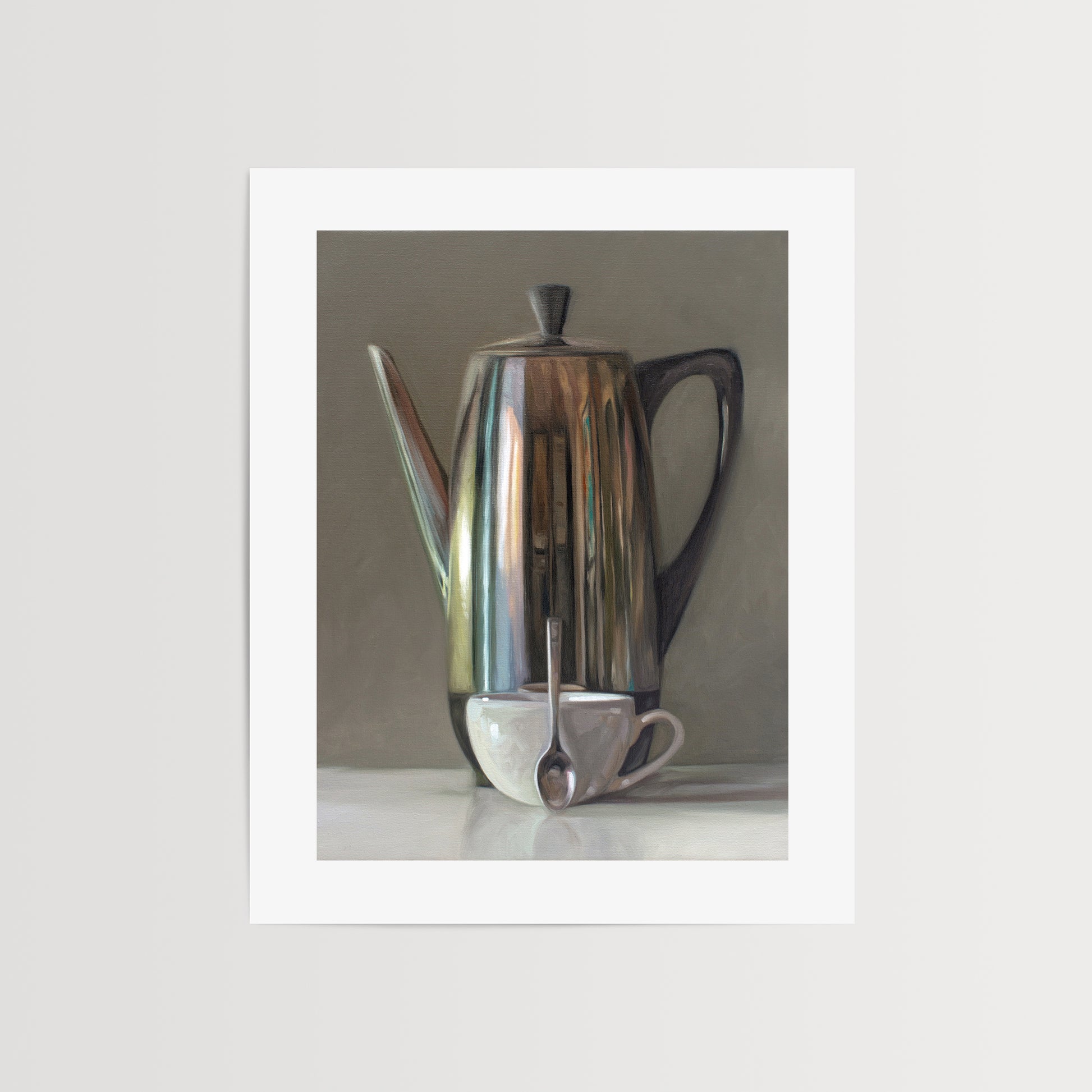 This artwork features a reflective percolator, porcelain coffee cup and small spoon resting on a light reflective surface with neutral grey tones.