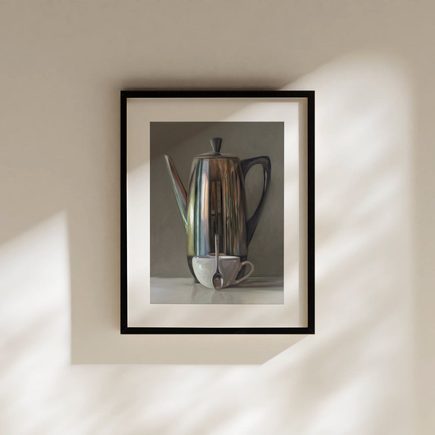 This artwork features a reflective percolator, porcelain coffee cup and small spoon resting on a light reflective surface with neutral grey tones.