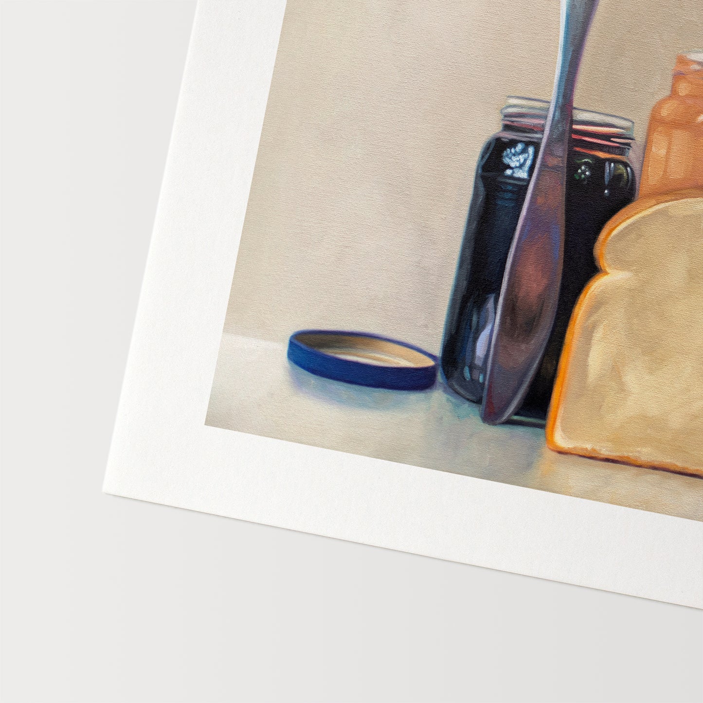 This artwork features all the things required to make a peanut butter and jelly sandwich lined up and ready to go on a light and neutral backdrop with subtle reflections.