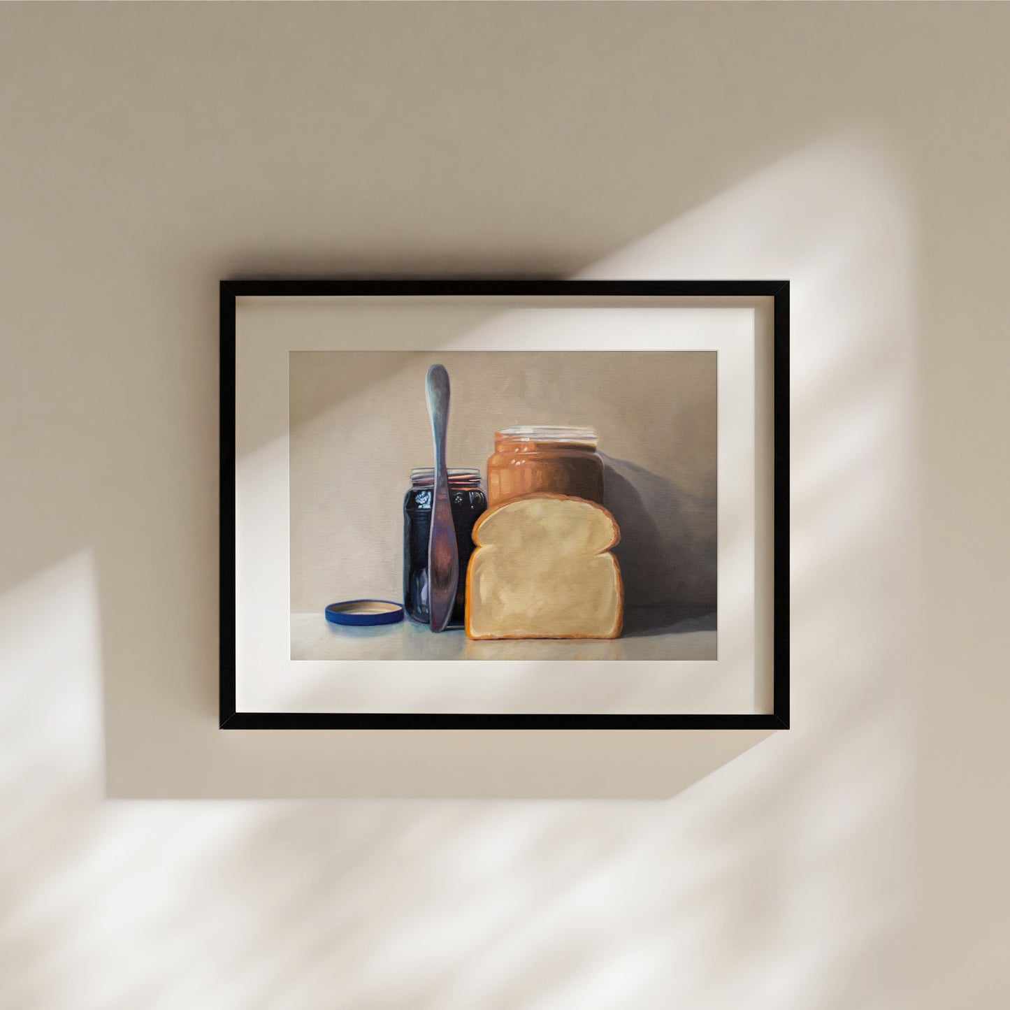 This artwork features all the things required to make a peanut butter and jelly sandwich lined up and ready to go on a light and neutral backdrop with subtle reflections.