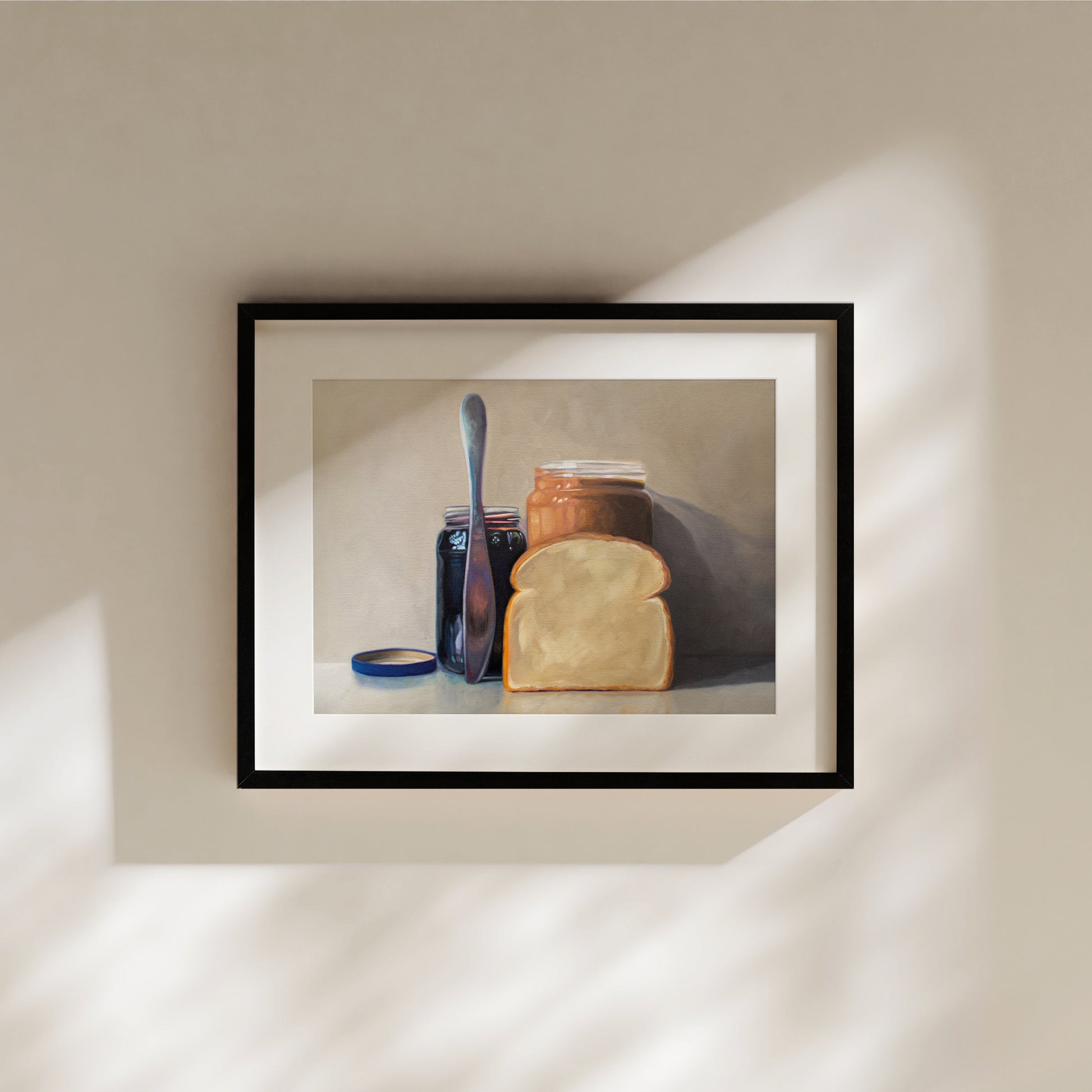 This artwork features all the things required to make a peanut butter and jelly sandwich lined up and ready to go on a light and neutral backdrop with subtle reflections.