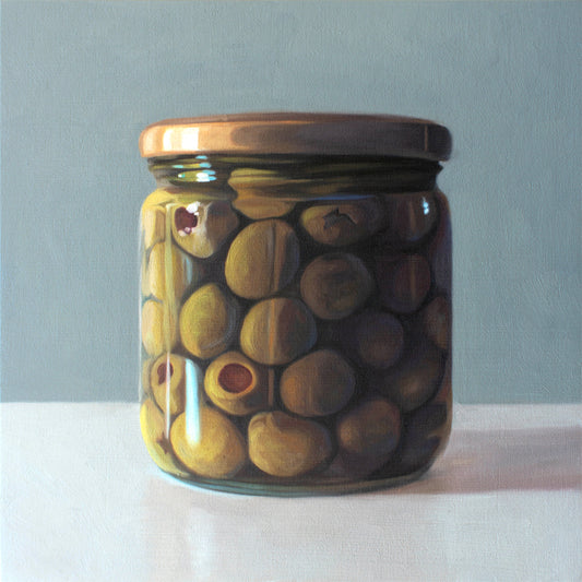 This artwork features a jar of green olives resting on a light, reflective surface with a muted blue/green background.