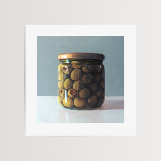 This artwork features a jar of green olives resting on a light, reflective surface with a muted blue/green background.