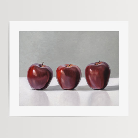 This artwork features a trio of Red Delicious apples resting on a light surface with a neutral grey background.