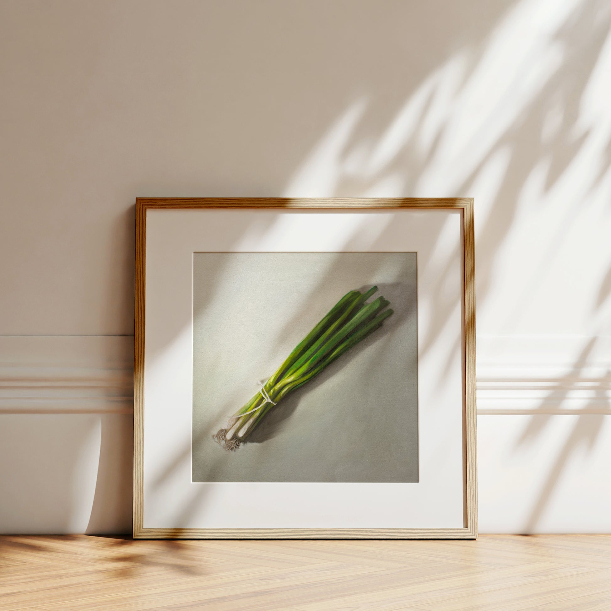 This artwork features a green onion bunch resting on a light grey surface.