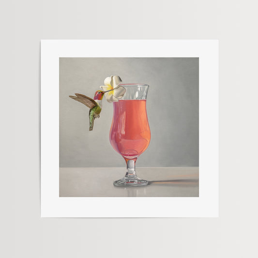 This artwork features an Anna’s Hummingbird visiting a plumeria blossom that rests on the lip of a pink cocktail.