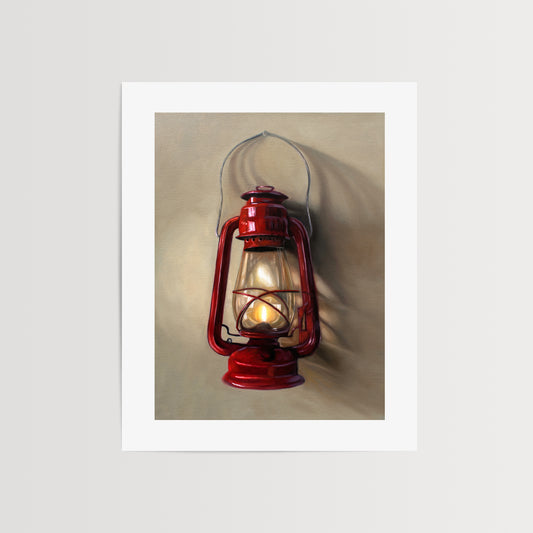 A vintage red lantern hangs from a single nail and casts a variety of interesting light and shadows upon the wall.