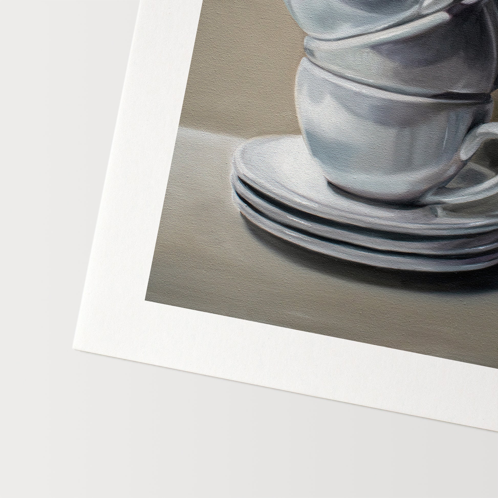 This artwork features a precariously balancing stack of porcelain cups and saucers.