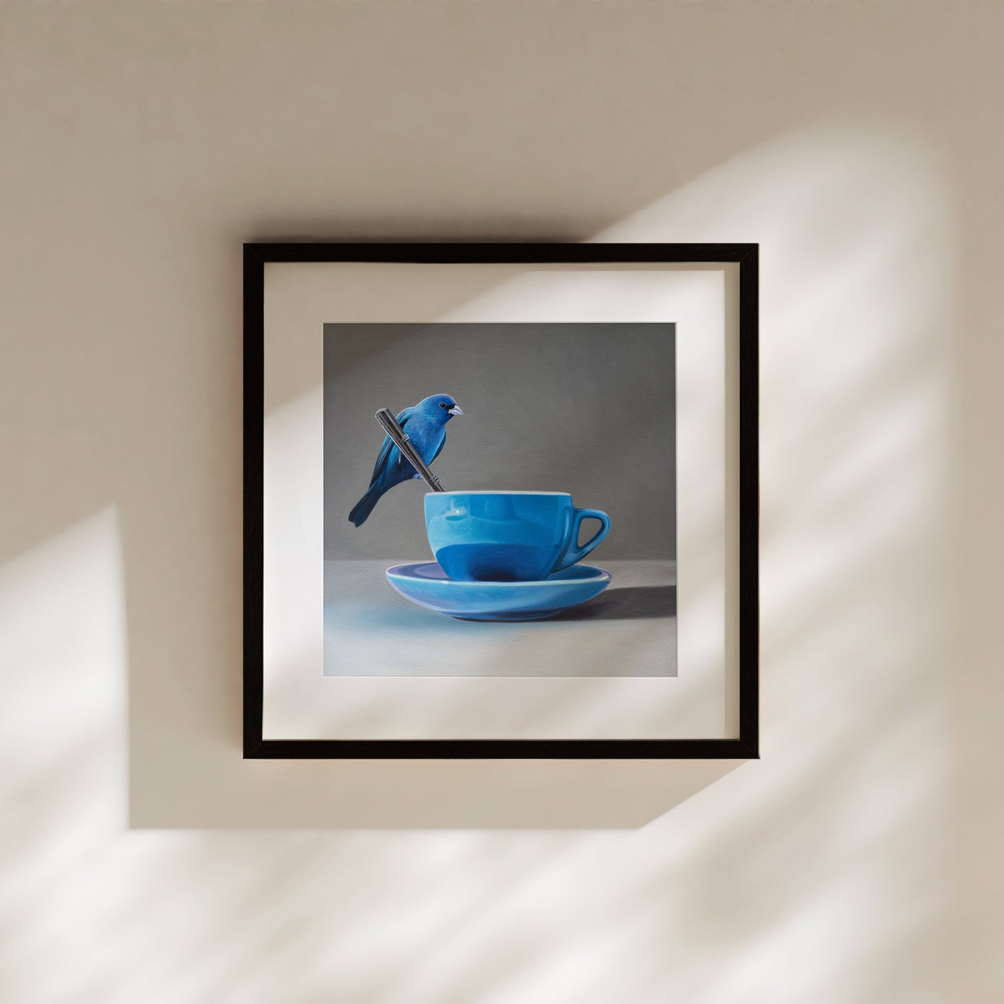 This artwork features an Indigo Bunting perched on the handle of a spoon resting on the edge of a blue cup with saucer.