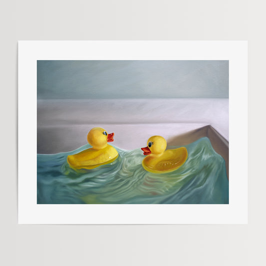 This artwork a pair of rubber duckies hitting the waves in a bathroom sink with some nice dramatic lighting.