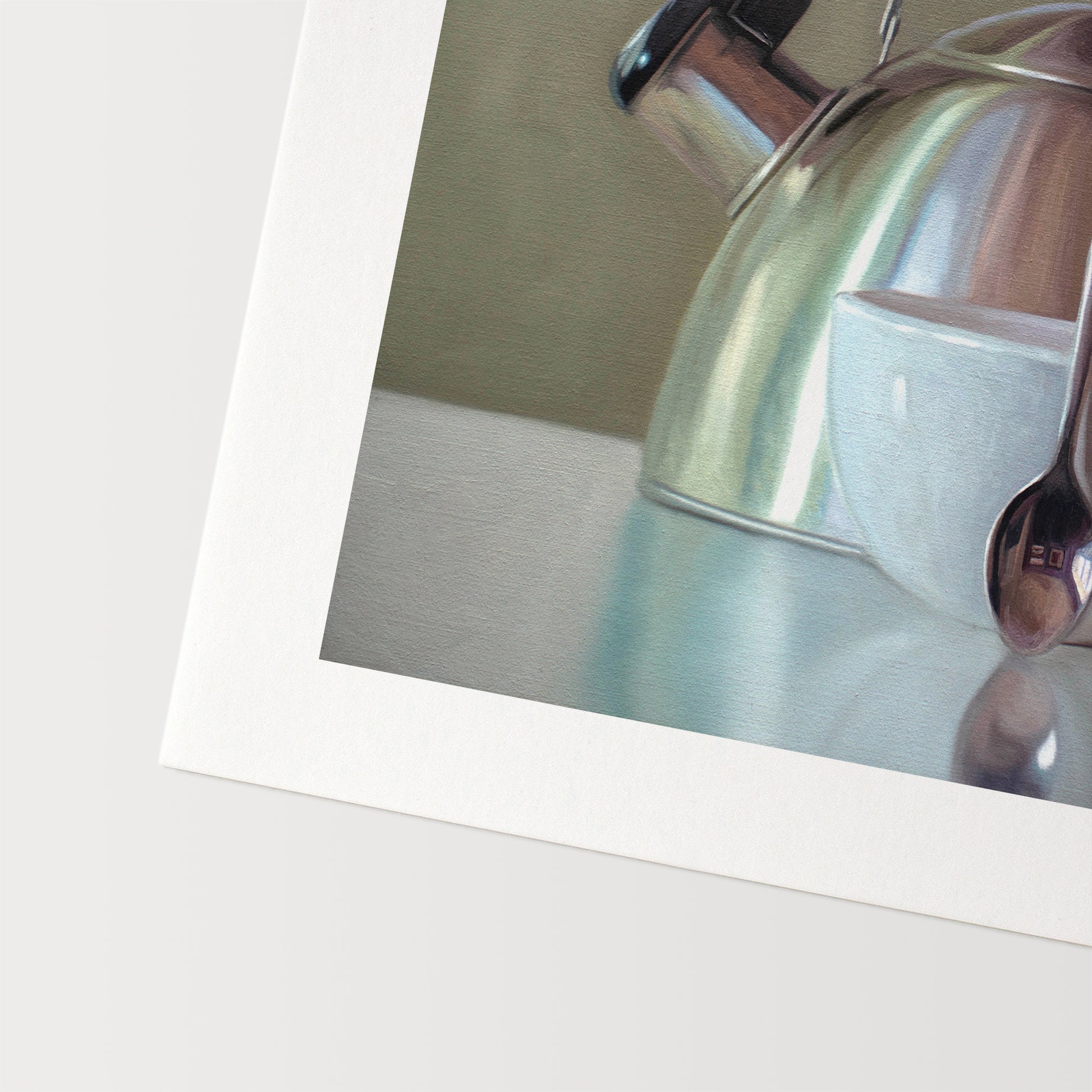 This artwork features a coffee cup resting next to a vintage tea kettle.This artwork is from a series featuring tea kettles paired with various objects.