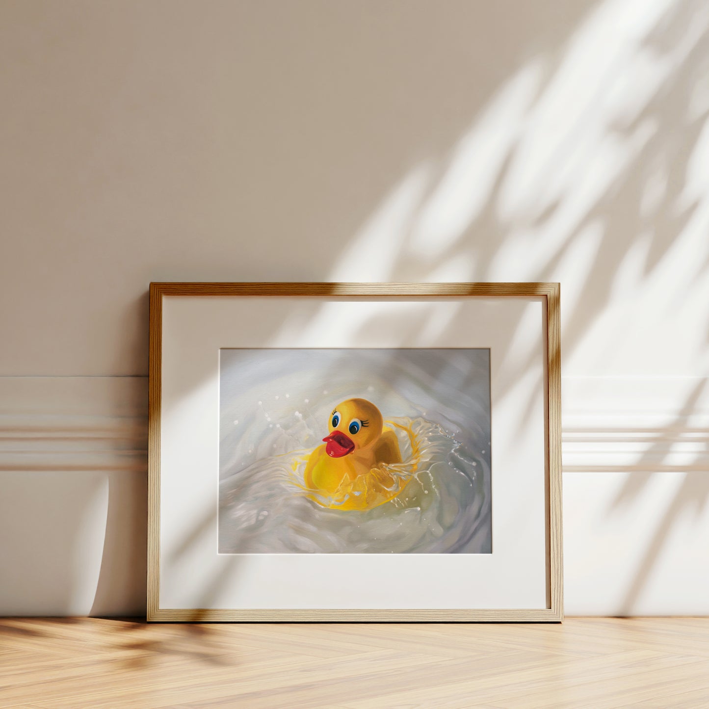 This artwork features a rubber ducky being dropped into a pool of water surrounded by ripples and splashes.