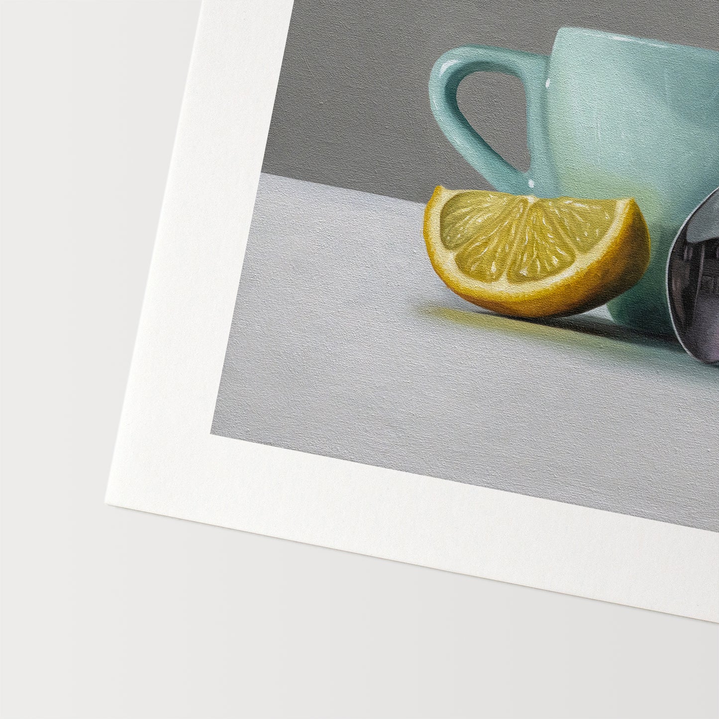 This artwork features a white lemon wedge, light blue cup and teaspoon.