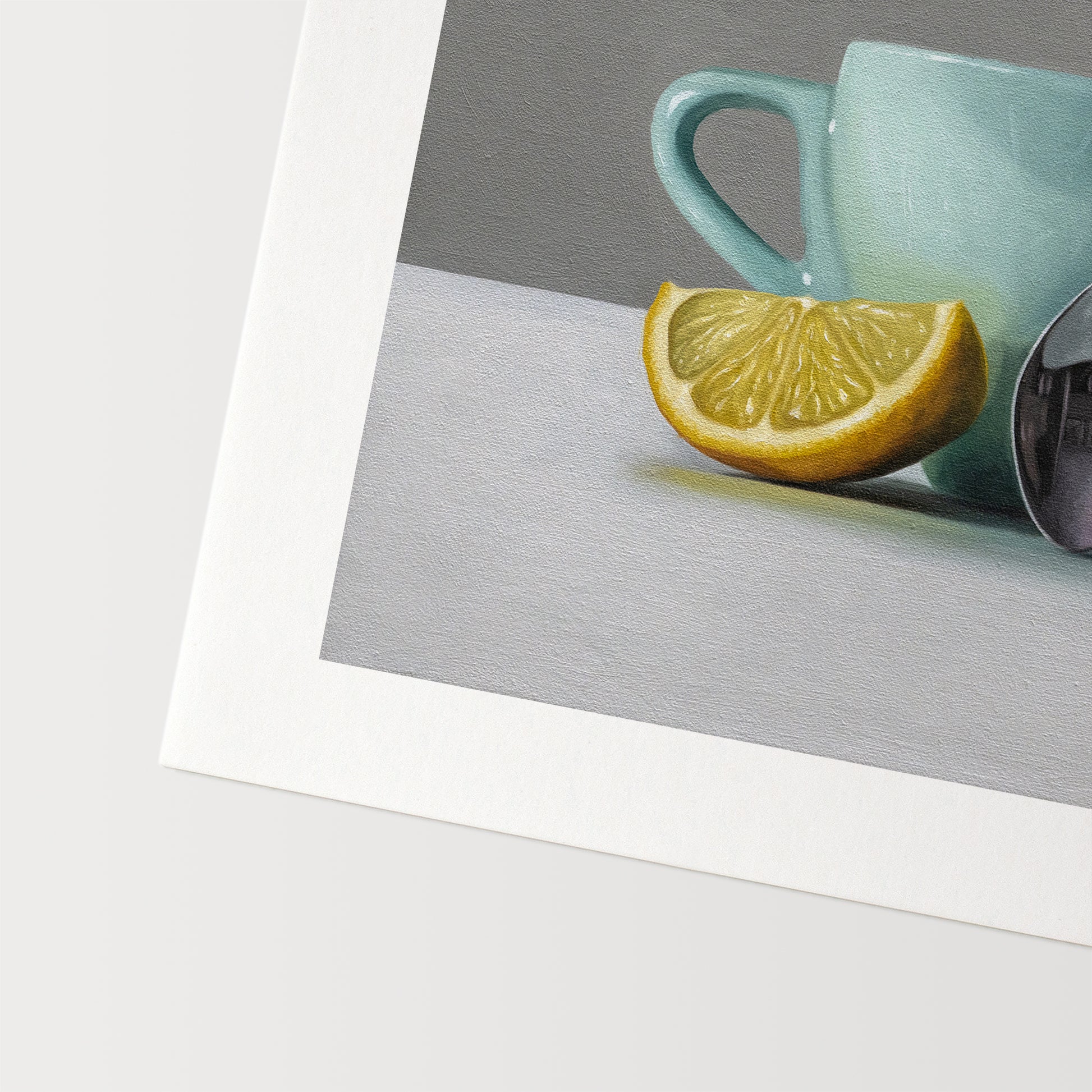 This artwork features a white lemon wedge, light blue cup and teaspoon.