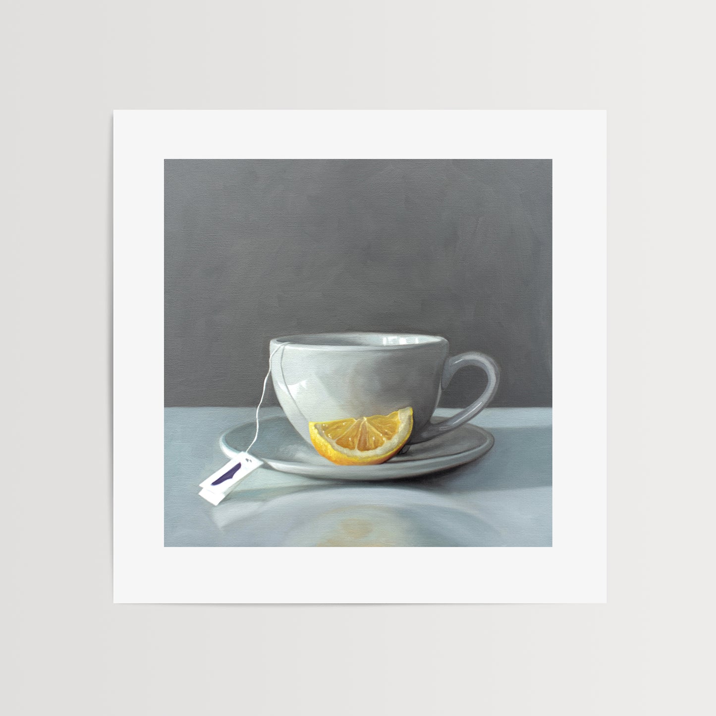 This artwork features a porcelain cup and saucer with tea and a lemon wedge.