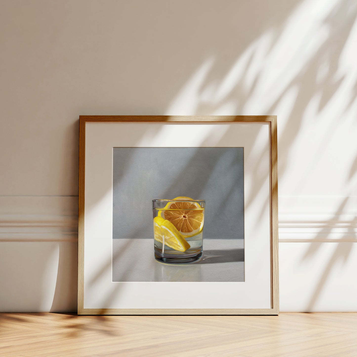 This artwork features a short glass of gin and tonic with two slices of lemon.